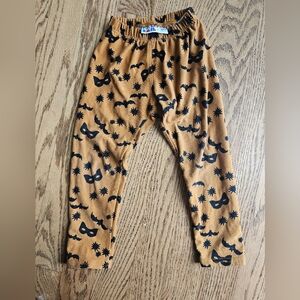Tan Pants with Black Mask and Star Pattern